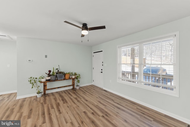 interior space with ceiling fan and light hardwood / wood-style floors