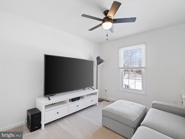 living room featuring ceiling fan and light colored carpet