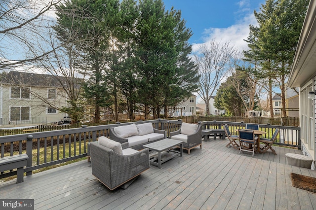 wooden deck featuring outdoor lounge area