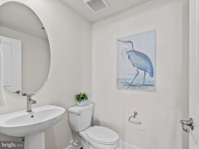 bathroom with sink and toilet