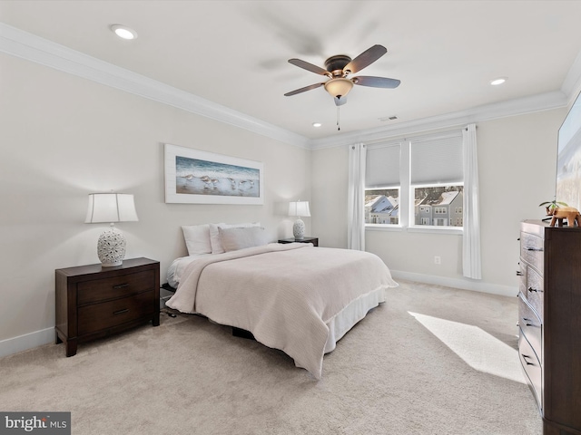 carpeted bedroom with ceiling fan and ornamental molding