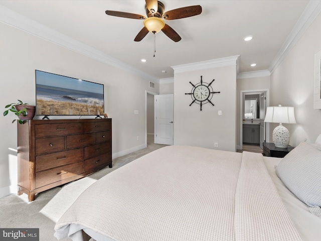 carpeted bedroom featuring ceiling fan, ornamental molding, and ensuite bath