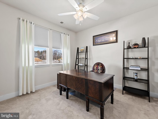 office featuring ceiling fan and light colored carpet