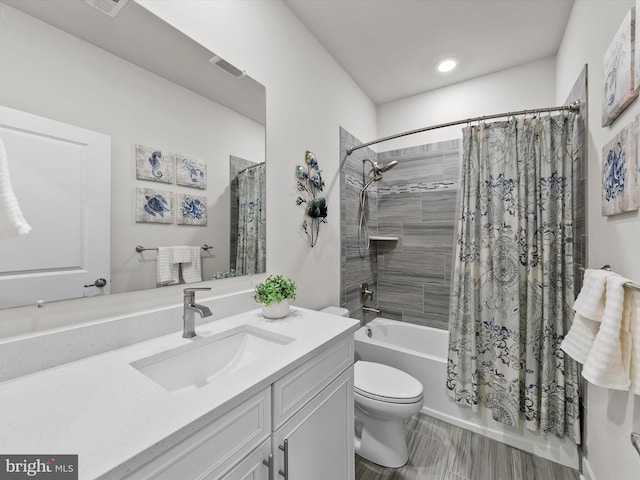 full bathroom featuring vanity, toilet, shower / bathtub combination with curtain, and hardwood / wood-style flooring