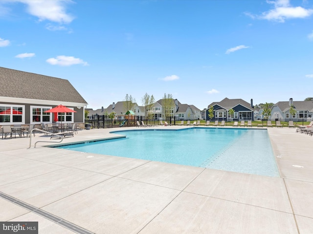 view of swimming pool with a patio