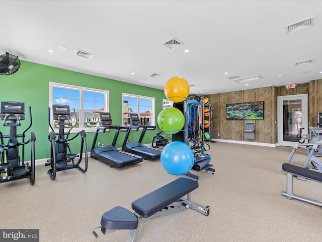 workout area with wooden walls