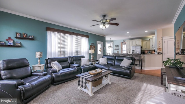 living room featuring plenty of natural light and crown molding