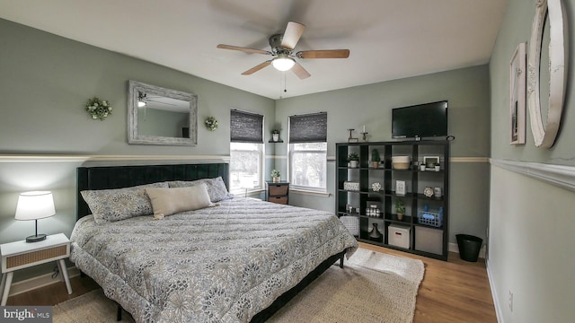 bedroom featuring ceiling fan and hardwood / wood-style floors