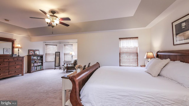 bedroom featuring ceiling fan and light colored carpet