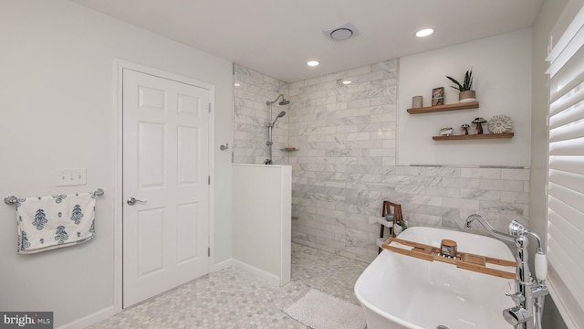 bathroom with separate shower and tub, tile walls, and sink