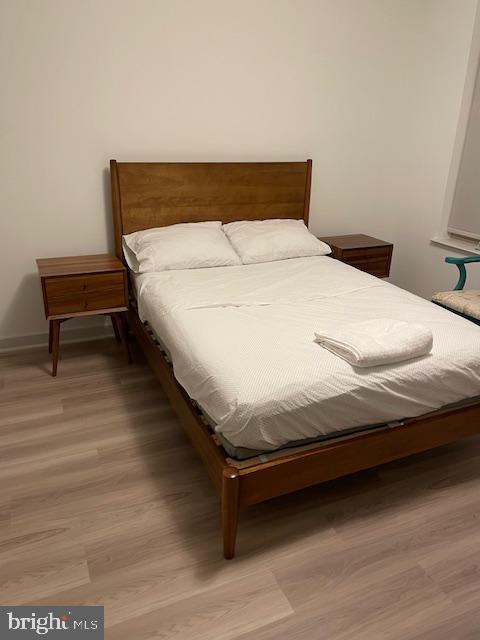 bedroom featuring hardwood / wood-style floors