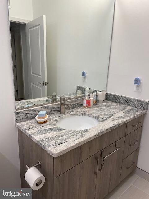 bathroom featuring vanity and tile patterned flooring