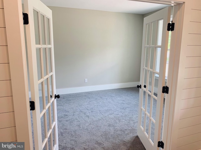 empty room with carpet and french doors