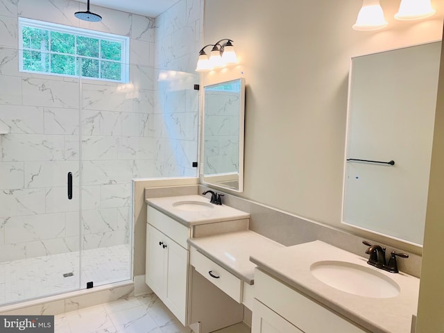 bathroom featuring an enclosed shower and vanity