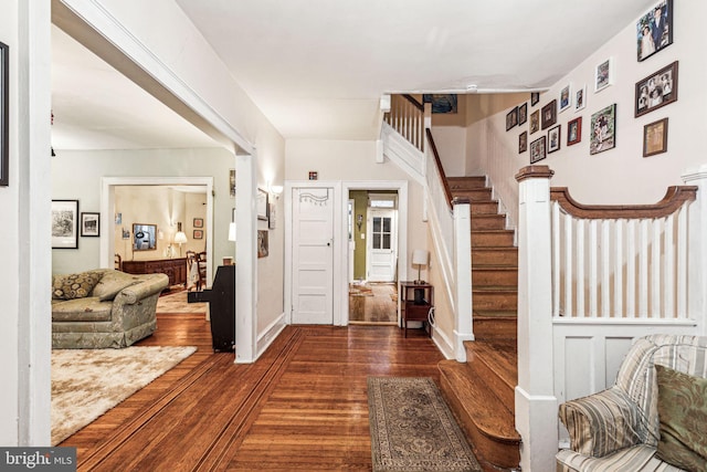 foyer with dark hardwood / wood-style floors