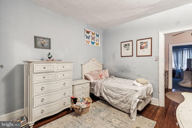 bedroom featuring dark hardwood / wood-style flooring