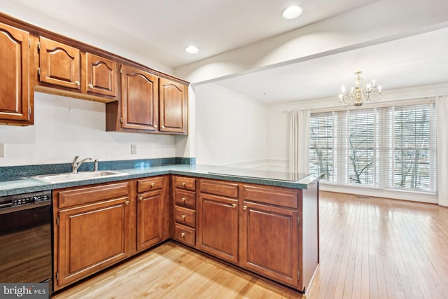 kitchen featuring dishwasher, sink, kitchen peninsula, a chandelier, and light hardwood / wood-style flooring