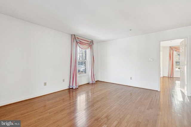 spare room featuring hardwood / wood-style flooring