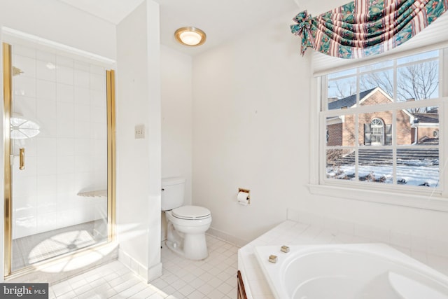 bathroom featuring plus walk in shower, toilet, and tile patterned floors