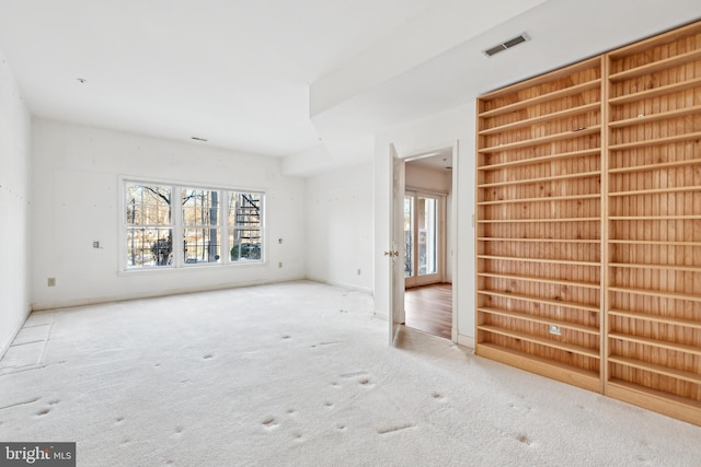 unfurnished room with carpet floors