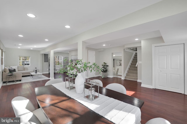 dining area featuring stairs, recessed lighting, wood finished floors, and baseboards