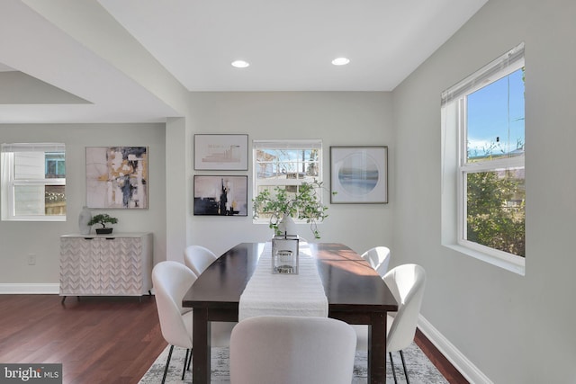 dining room with dark wood finished floors, plenty of natural light, recessed lighting, and baseboards