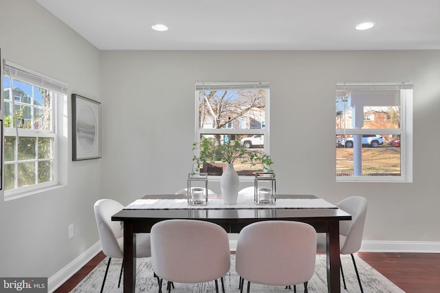 dining area with recessed lighting, baseboards, and dark wood-type flooring