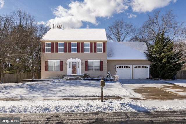 colonial home featuring a garage