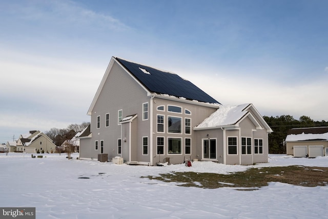 view of snow covered house