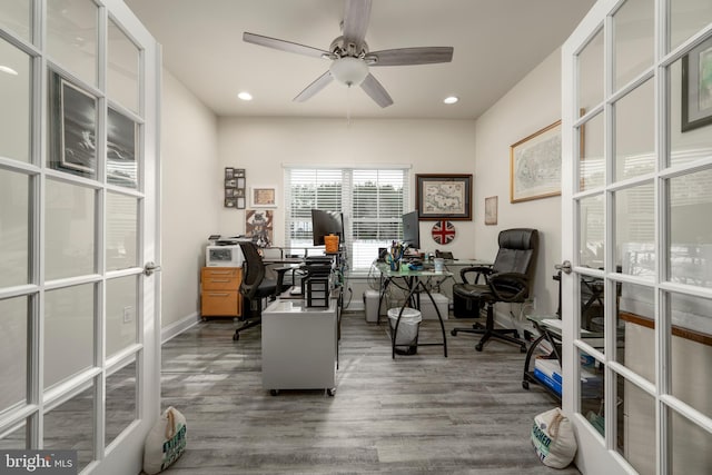 office space featuring ceiling fan, dark hardwood / wood-style flooring, and french doors