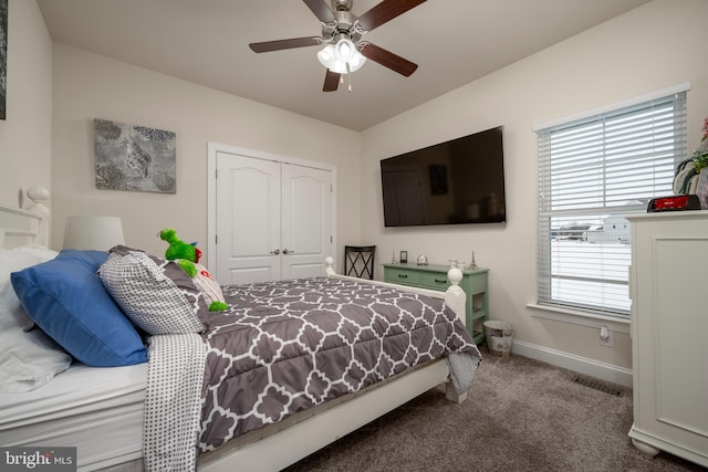 bedroom with ceiling fan, a closet, and carpet flooring