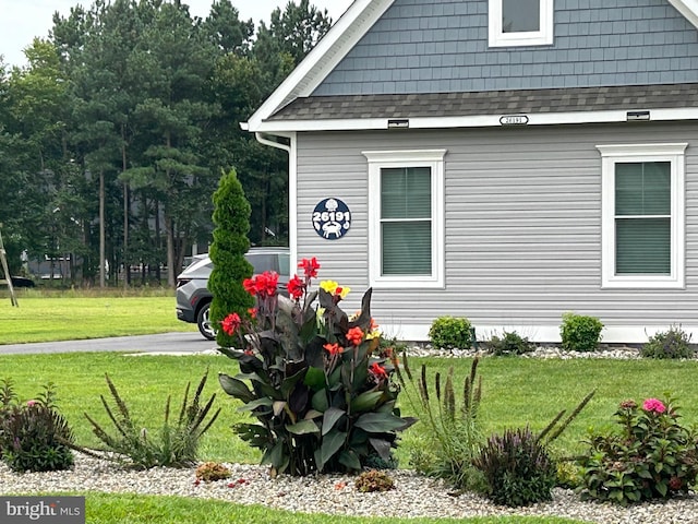 view of property exterior featuring a yard