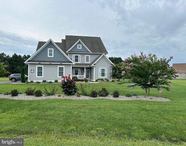 view of front of house featuring a front lawn and a porch