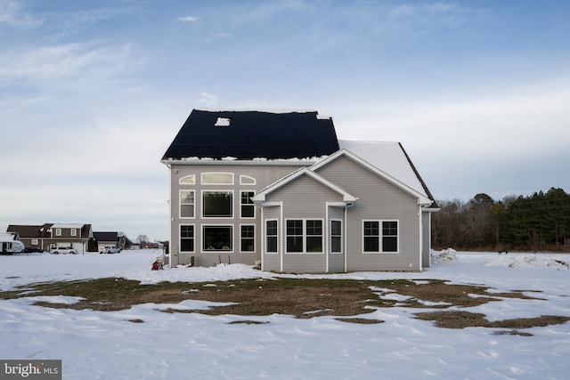 view of snow covered house