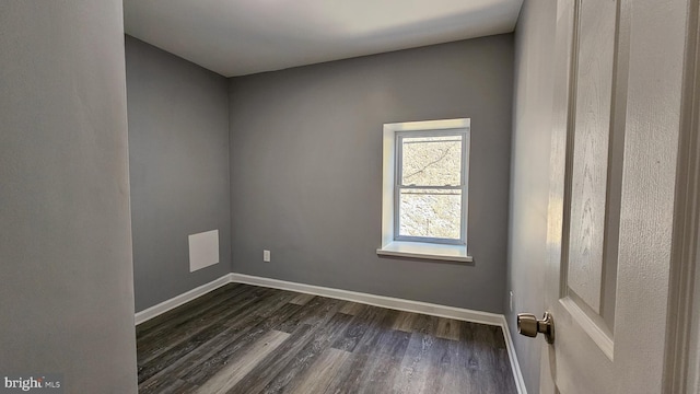 spare room with dark hardwood / wood-style floors