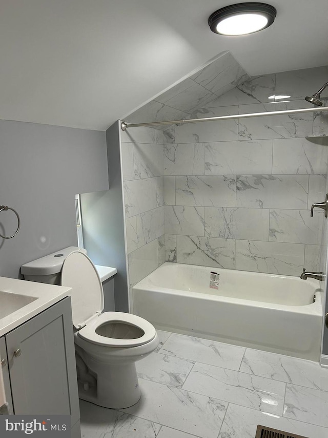 full bathroom with vanity, toilet, and tiled shower / bath combo