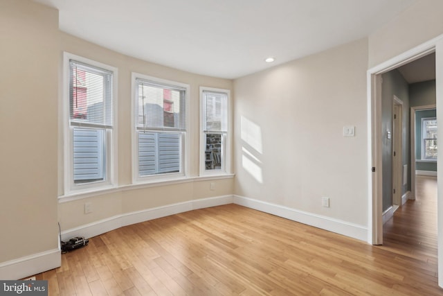 spare room featuring light hardwood / wood-style floors