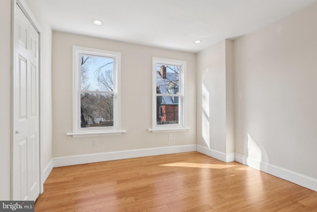 empty room with light hardwood / wood-style floors