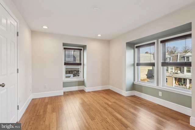 unfurnished room with light hardwood / wood-style floors