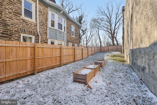 view of yard covered in snow