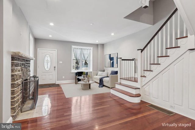 foyer entrance featuring hardwood / wood-style floors