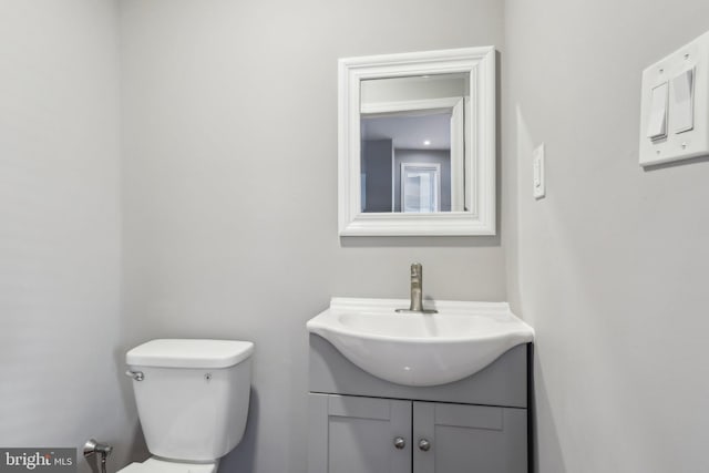 bathroom with toilet and vanity