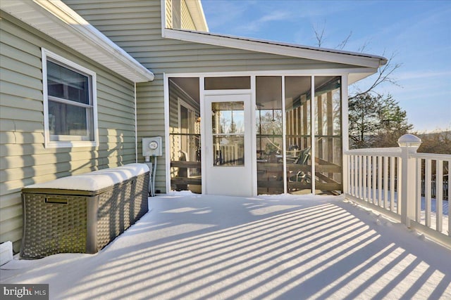 wooden terrace with a sunroom