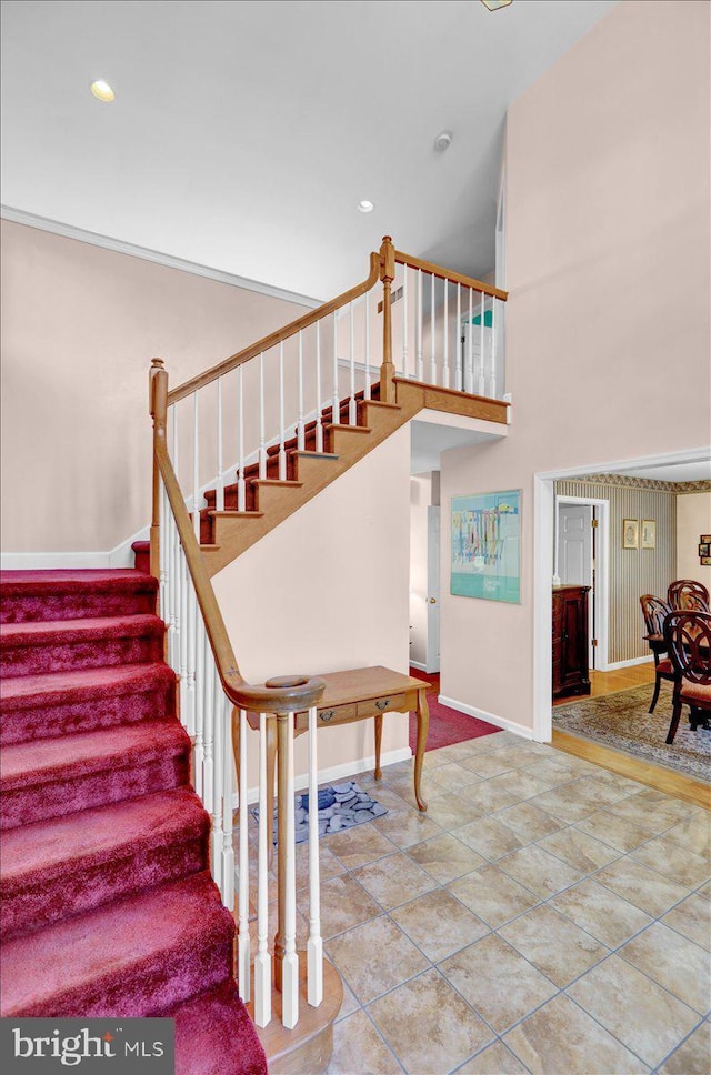 stairway with tile patterned flooring