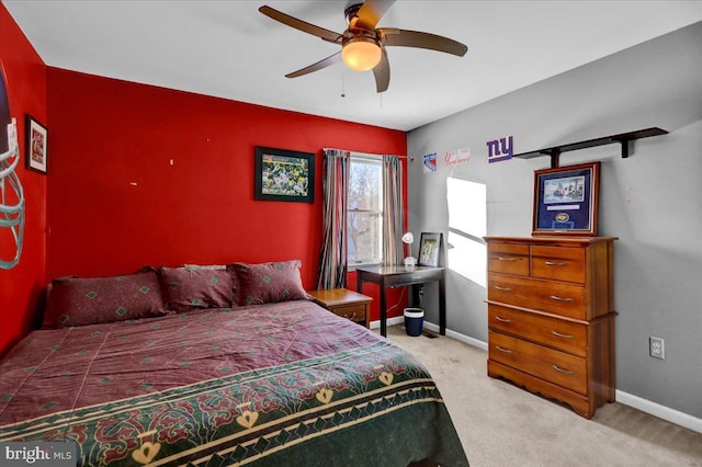 bedroom featuring ceiling fan and light colored carpet