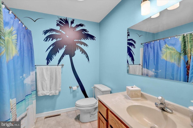 bathroom featuring toilet, vanity, tile patterned flooring, and a shower with curtain