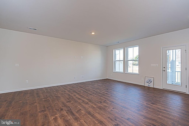 spare room featuring dark hardwood / wood-style flooring