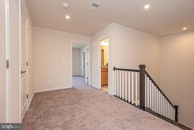 hall featuring carpet floors