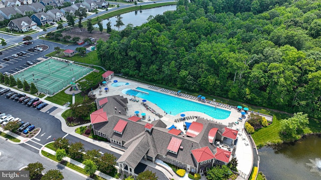 birds eye view of property with a water view