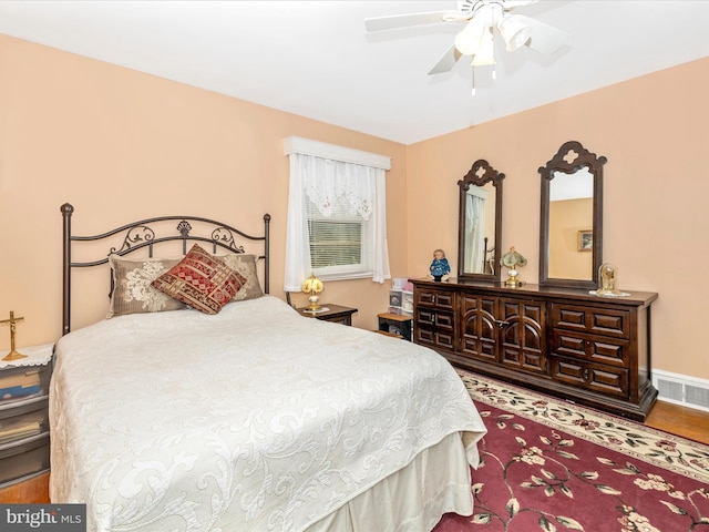 bedroom featuring hardwood / wood-style floors and ceiling fan